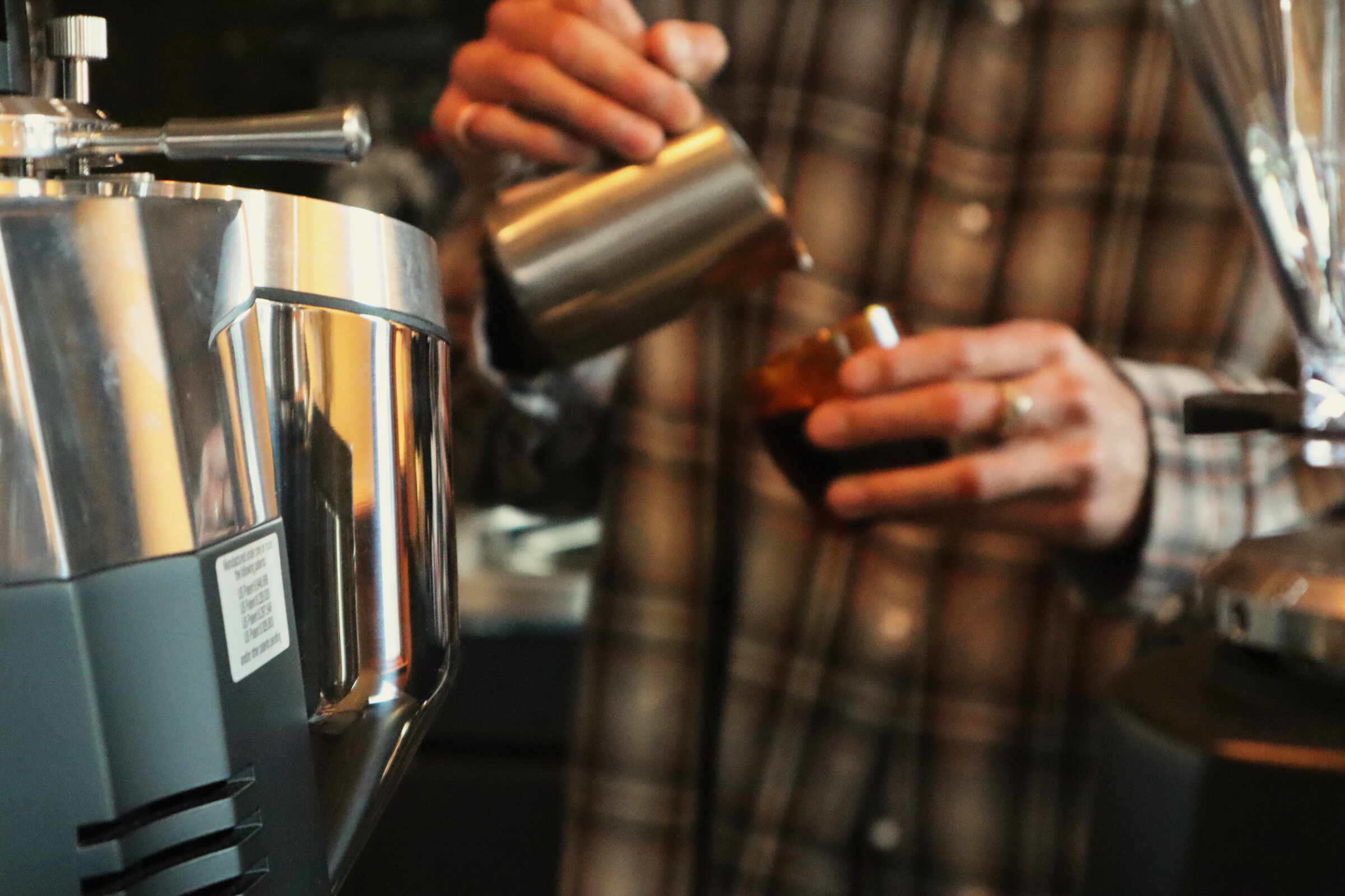 Milk pouring into a coffee